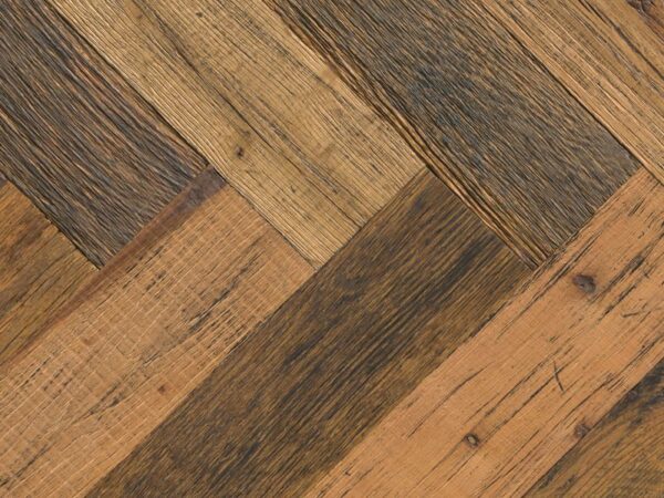The contrasting characteristics of salvaged wood and precision cutting are fused to create stunning herringbone and chevron flooring. The creative process begins with selecting the finest materials from around the world which are shaped into extraordinary pieces of modern-day flooring by master craftsmen. Traditional methods are used throughout the process which begins with pressing 4mm veneers of history onto an FSC – certified plywood base for stability – each one cut meticulously for an exacting fit. Our Herringbone and Chevron collection is complemented with a matching plank format which is perfect for defining different spaces without compromising the overall desired effect. HERRINGBONE HISTORIC MADISON OAK 115 X 15 X 575MM